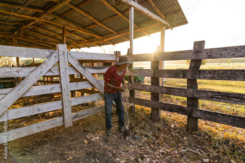 Man in farmyard for farm animals photo