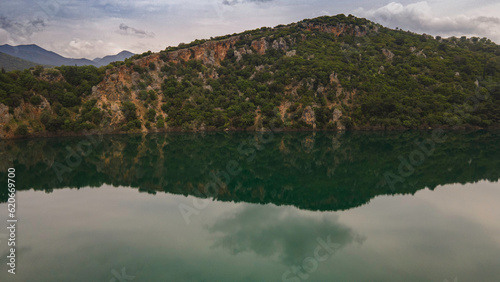 reflection of trees in the lake © Spiros