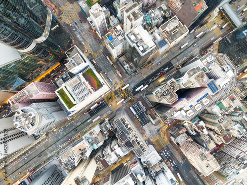 Cityscape skyscraper buildings, car traffic transport on road in Mong Kok town district, Hong Kong downtown. Drone aerial top view. Asian people lifestyle, Asia city life or public transportation