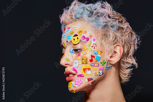 Girl with colorful hair and makeup, stickers on face photo