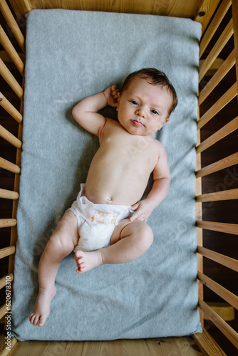 Overhead view of baby in bassinet