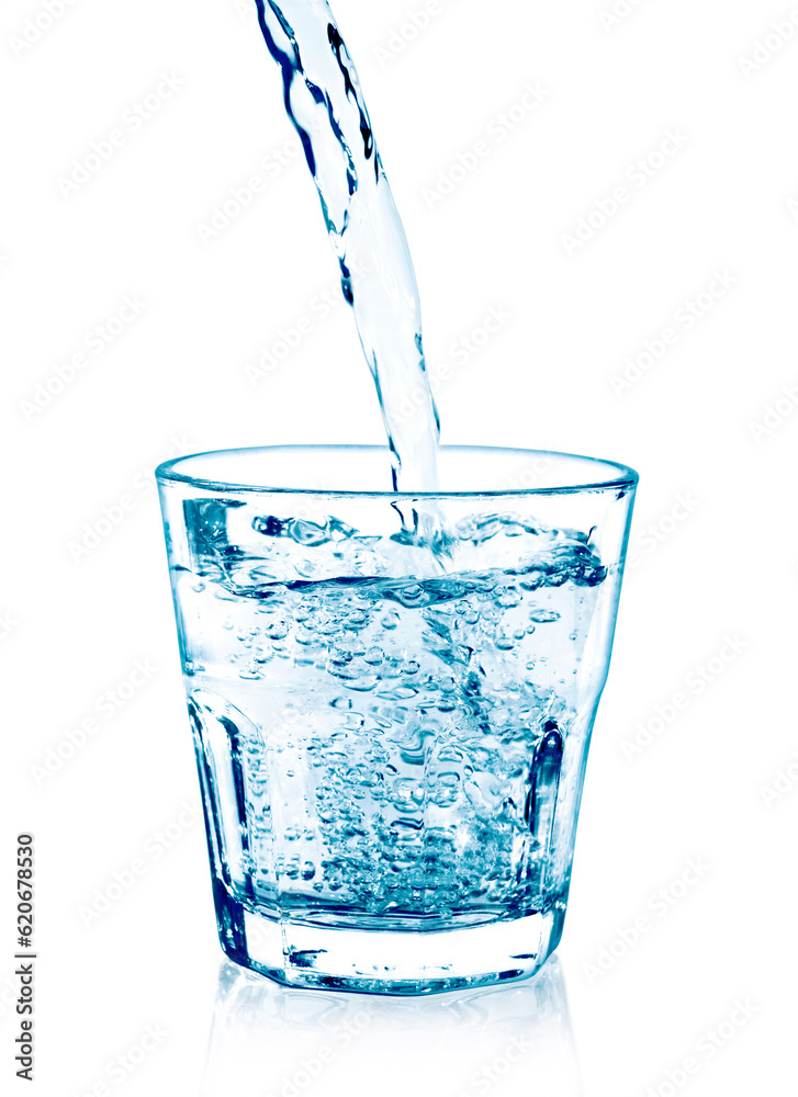 pouring water on a glass on white background pouring water on a glass on white background
