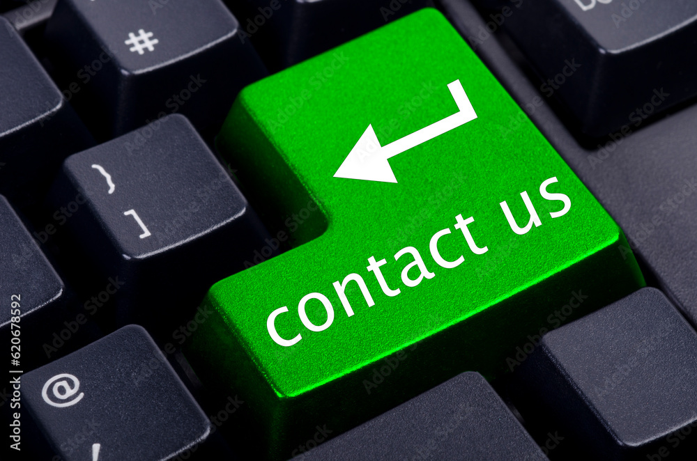 green contact us button on the black keyboard green contact us button on the black keyboard
