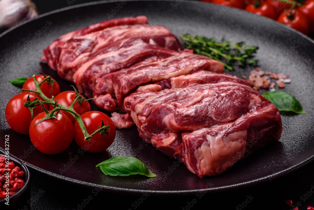 Fresh raw beef ribs with salt, spices and herbs Fresh raw beef ribs with salt, spices and herbs