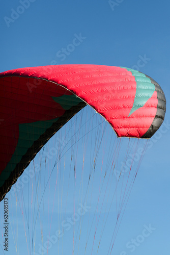 An abstract view of a paraglider against a blue sky  photo