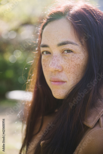 Asian woman with freckles