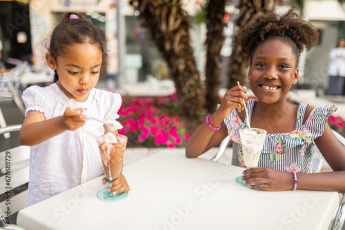 black sisters eating ice cream in the city photo