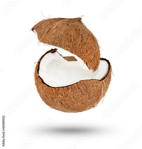 Flying coconut. Half of a coconut with a flying lid on a white isolated background. Part of the coconut hangs or falls, casting a shadow.