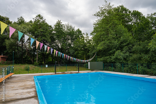 home pool in the garden and on the terrace  with blue nature for relaxation