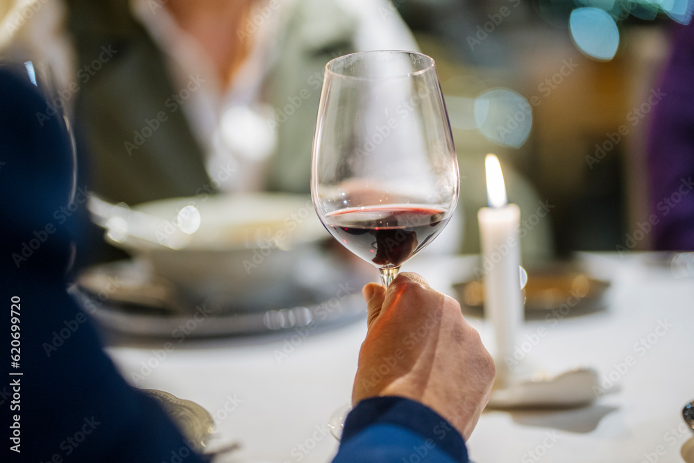 Crop man with wineglass in restaurant Crop man with wineglass in restaurant
