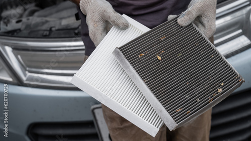 The master changes the cabin air filter of the car.