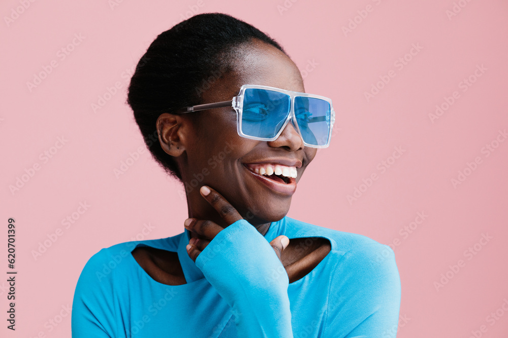 © Sergey Filimonov/Stocksy - Content woman smiling looking away