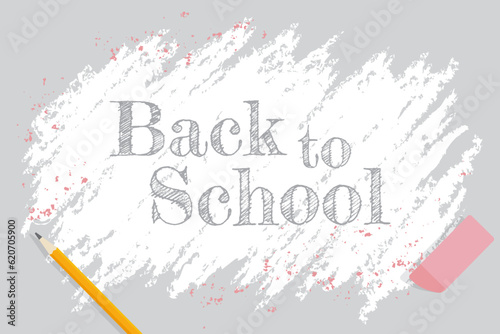 An erased area with back to school text, pencil, eraser, and pink flakes

