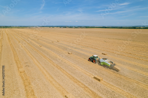 Tractors are used to collect and transport the straw from the field.