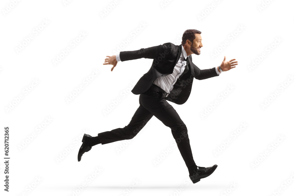 Full length profile shot of a businessman running fast