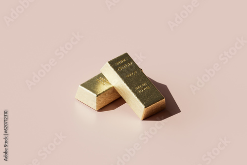two gold bars on pink. photo