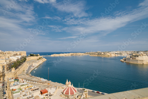 Grand Harbour of Malta with the ancient walls of Valletta on a sunny day.