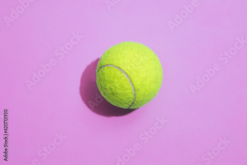 Tennis ball on a colorful background with hard lighting photo