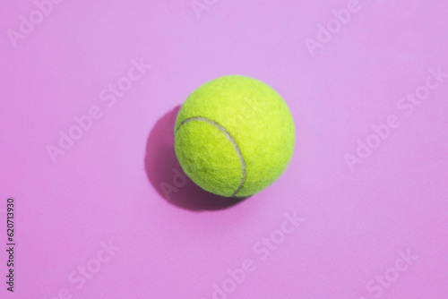 Tennis ball on a colorful background with hard lighting