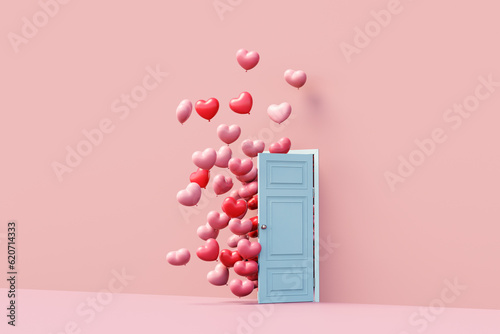 Pink heart balloons coming out of door. Valentine's day love concept photo