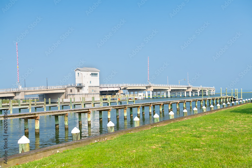 Road through the swamps to the Chincoteague bay nature reserve. Aerial view of the road and the reserve.