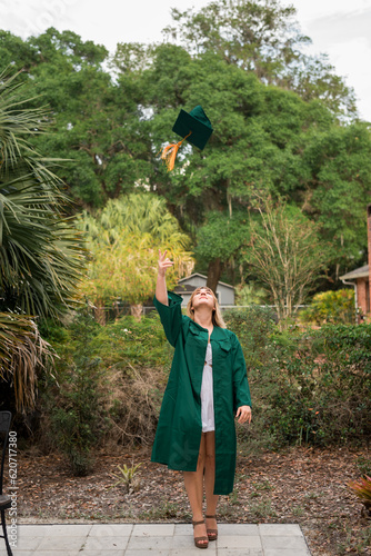 Student tossing graduation cap