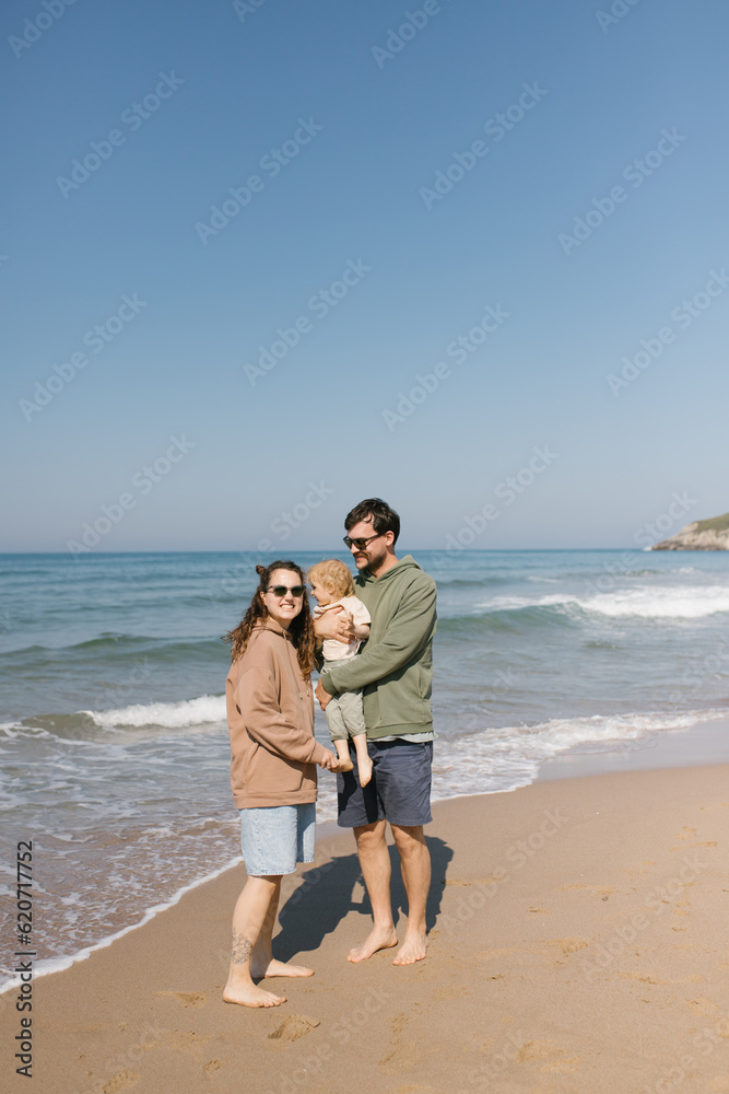 Spouses with child by the sea Spouses with child by the sea