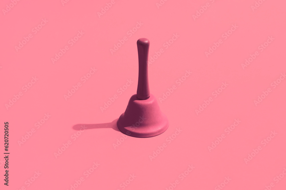 A pink bell on a pink background. Monochromatic composition A pink bell on a pink background. Monochromatic composition
