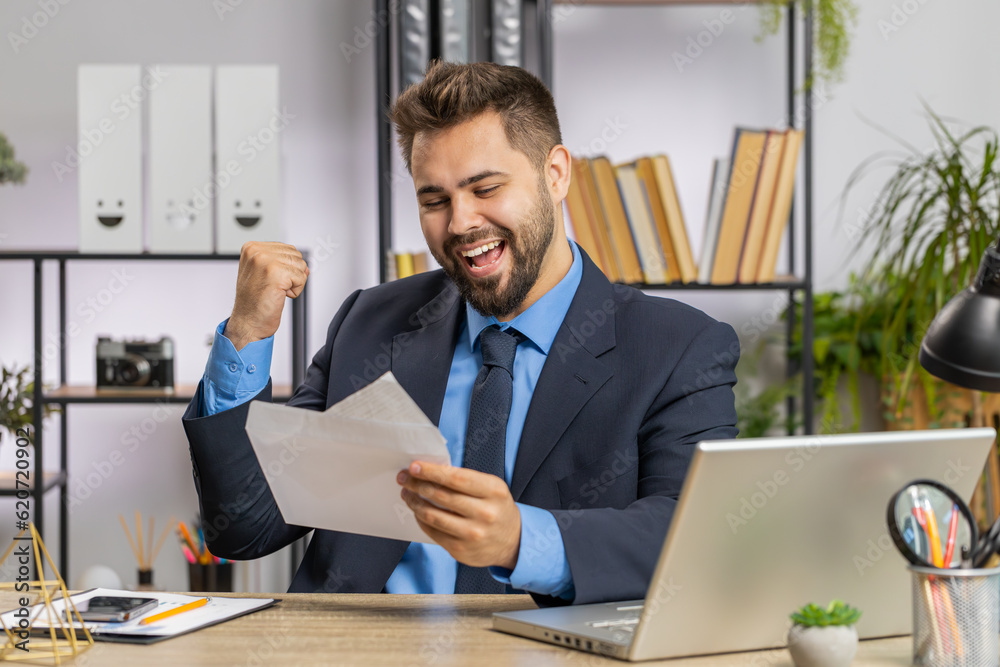 Caucasian business man open envelope letter, reading it. Career growth advance promotion, bank loan approve, successful admission to monetary award, long-awaited invitation great news lottery game win