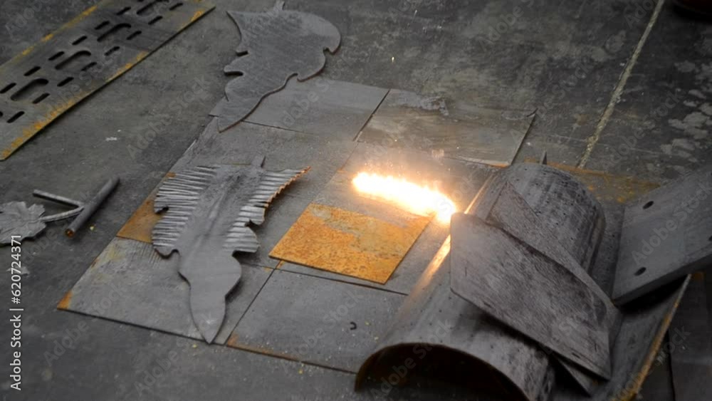 Laser cleaning of metal. Industrial laser cleaning rust of metal. Industrial removal of rust of metal surface with laser beam. Man cleaning surface from corrosion with laser metal cleaning machine