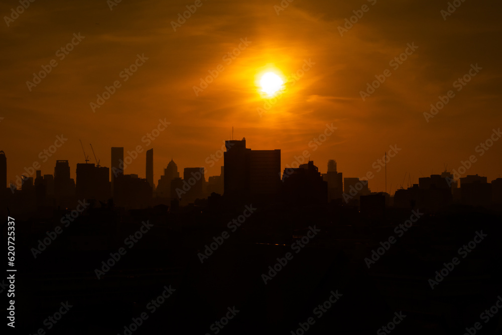 silhouette city against the sky on a sunrise Bangkok city.
silhouette city against the sky on a sunrise Bangkok city.