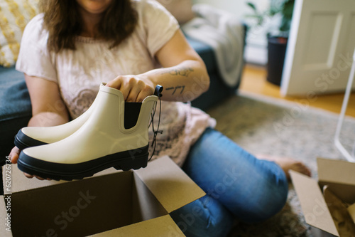 online shopper unboxing her purchase at home