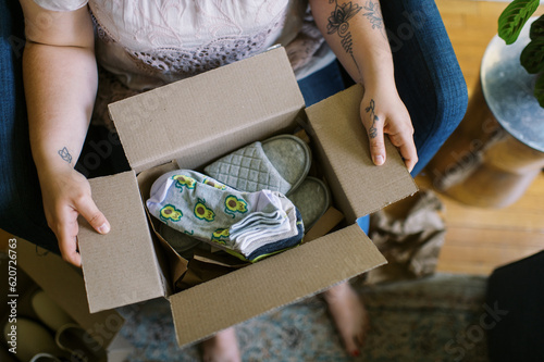 online shopper unboxing her purchase at home