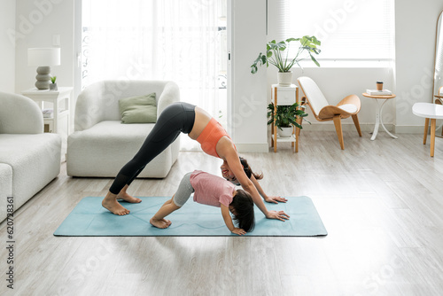 Mother and daughter doing exercise home