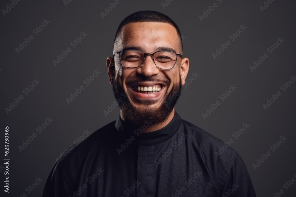 Portrait of a happy young man in eyeglasses on a dark background Portrait of a happy young man in eyeglasses on a dark background