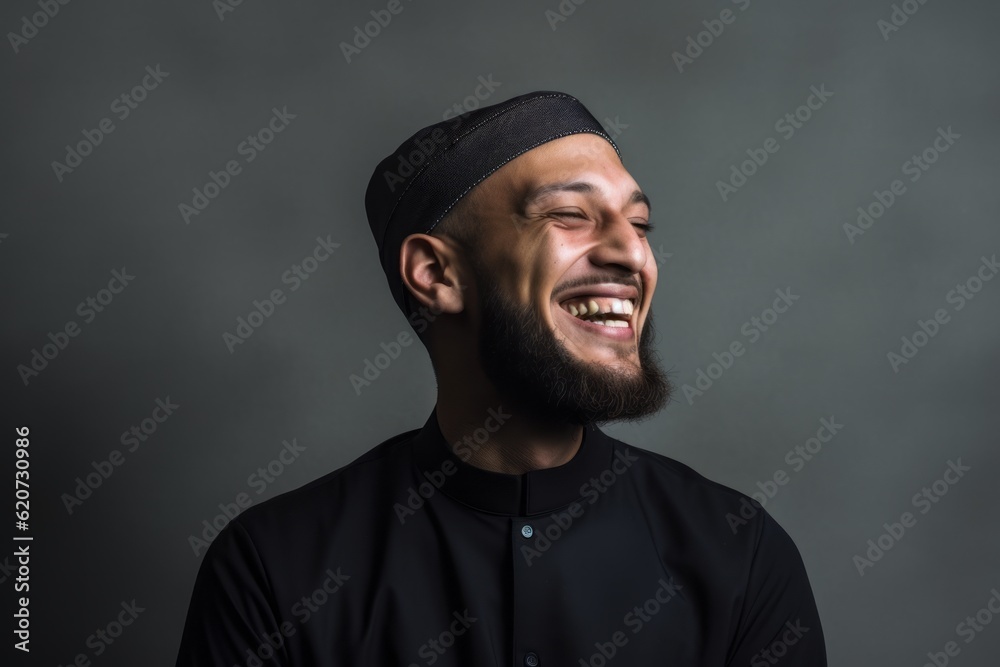 Portrait of a happy muslim man laughing and looking at camera Portrait of a happy muslim man laughing and looking at camera