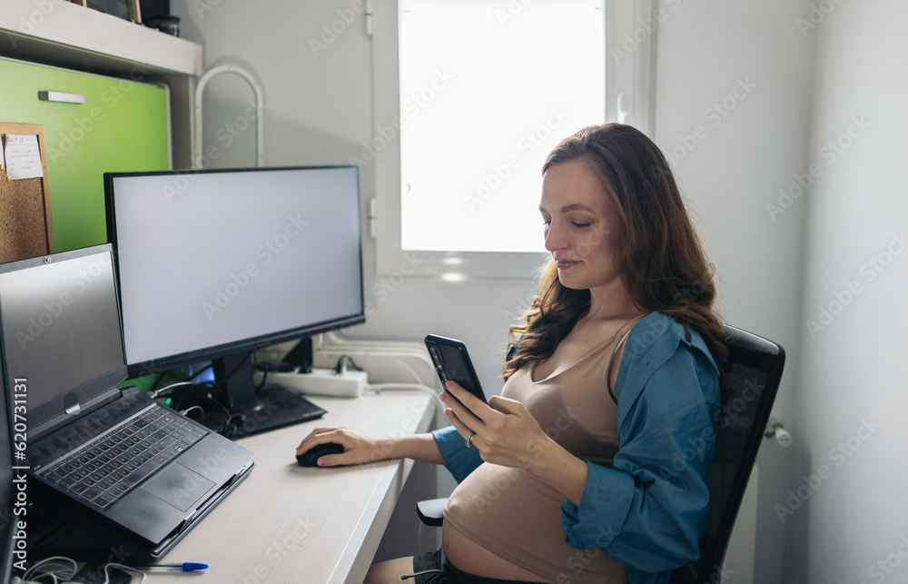 Freelance pregnant woman working in her home office Freelance pregnant woman working in her home office