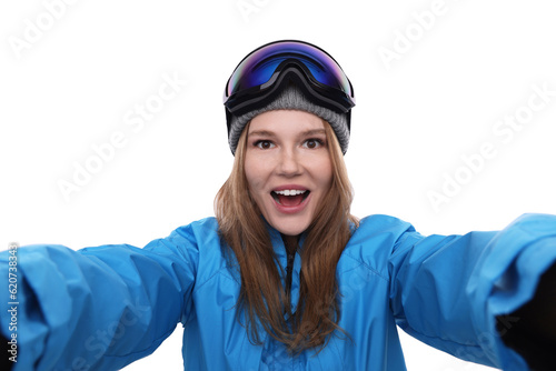 Emotional woman in ski goggles taking selfie on white background © New Africa