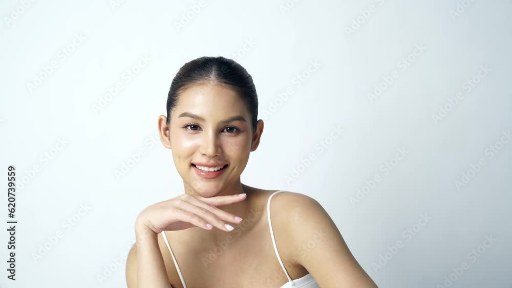 Beautiful Young asian Woman with Clean Fresh Skin on white background, Face care, Facial treatment, Cosmetology, beauty and spa, Asian women portrait Beautiful Young asian Woman with Clean Fresh Skin on white background, Face care, Facial treatment, Cosmetology, beauty and spa, Asian women portrait