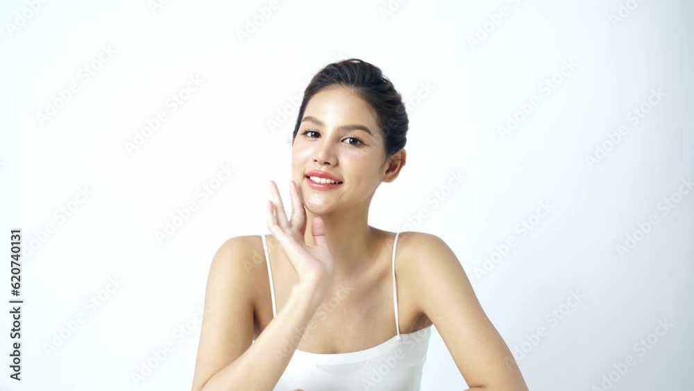 Beautiful Young asian Woman with Clean Fresh Skin on white background, Face care, Facial treatment, Cosmetology, beauty and spa, Asian women portrait Beautiful Young asian Woman with Clean Fresh Skin on white background, Face care, Facial treatment, Cosmetology, beauty and spa, Asian women portrait