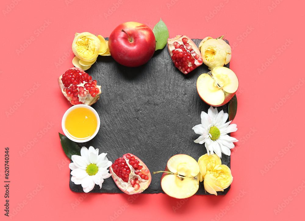 Composition with slate board, ripe fruits, flowers and honey on red background. Rosh hashanah (Jewish New Year) celebration Composition with slate board, ripe fruits, flowers and honey on red background. Rosh hashanah (Jewish New Year) celebration