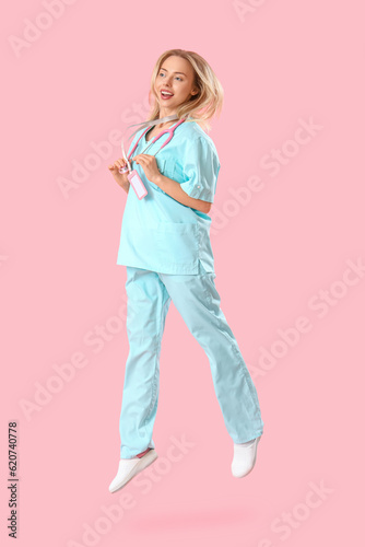 Female medical intern jumpi...