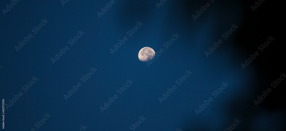 The moon in the blue sky in the morning, natural background. The moon in the blue sky in the morning, natural background.