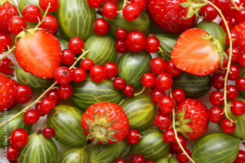 Fototapeta Naklejka Na Ścianę i Meble -  Fresh strawberry, currant and gooseberry as background, closeup