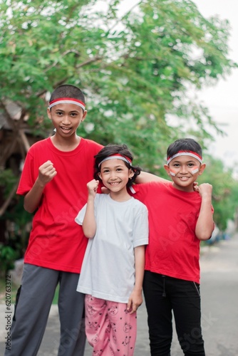 Indonesian kids boy and girl celebrate independence day at outdoor