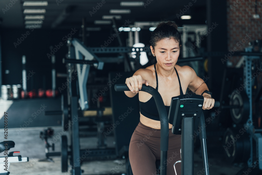 Fototapeta premium Asian beautiful sport woman exercise on treadmill machine gym is sport healthy body building in fitness lifestyle