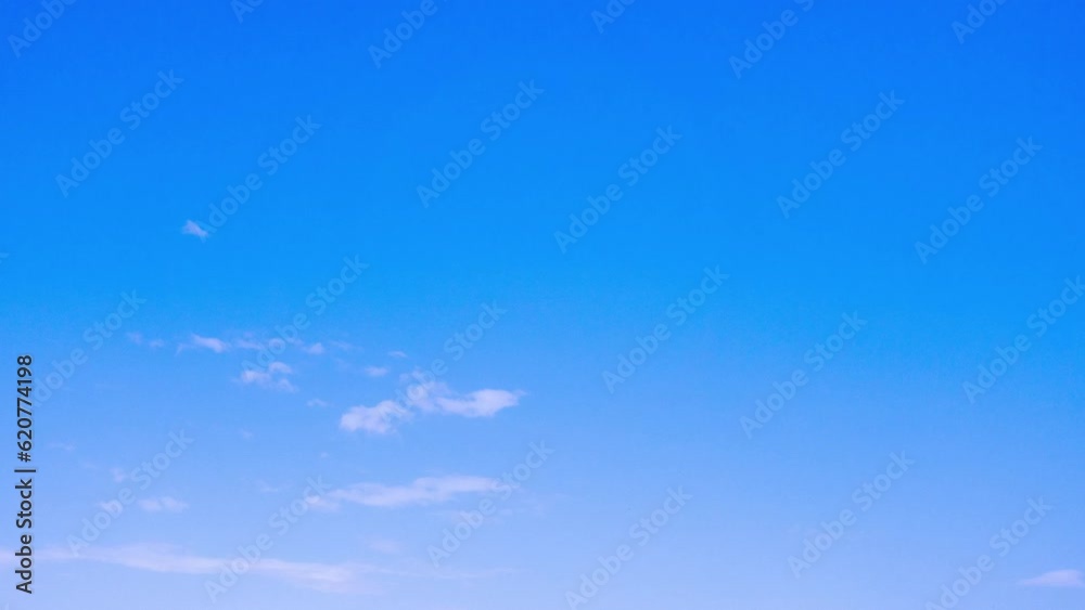 Delicate cirrus clouds float across the blue sky and turn into thunderclouds. Rainbow on the background of clouds. Summer sky before the rain, during the rain. Time interval. 4k