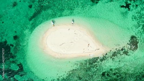 SAND ISLAND IN THE OCEAN LOOKING DOWN DRONE SHOT - NAKED ISLAND PHILIPPINES photo