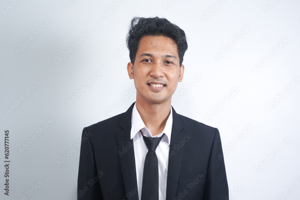 Portrait of handsome asian man in formal suit looking at camera smiling with toothy smile isolated in white background. Confident businessman ceo boss freelancer manager Portrait of handsome asian man in formal suit looking at camera smiling with toothy smile isolated in white background. Confident businessman ceo boss freelancer manager
