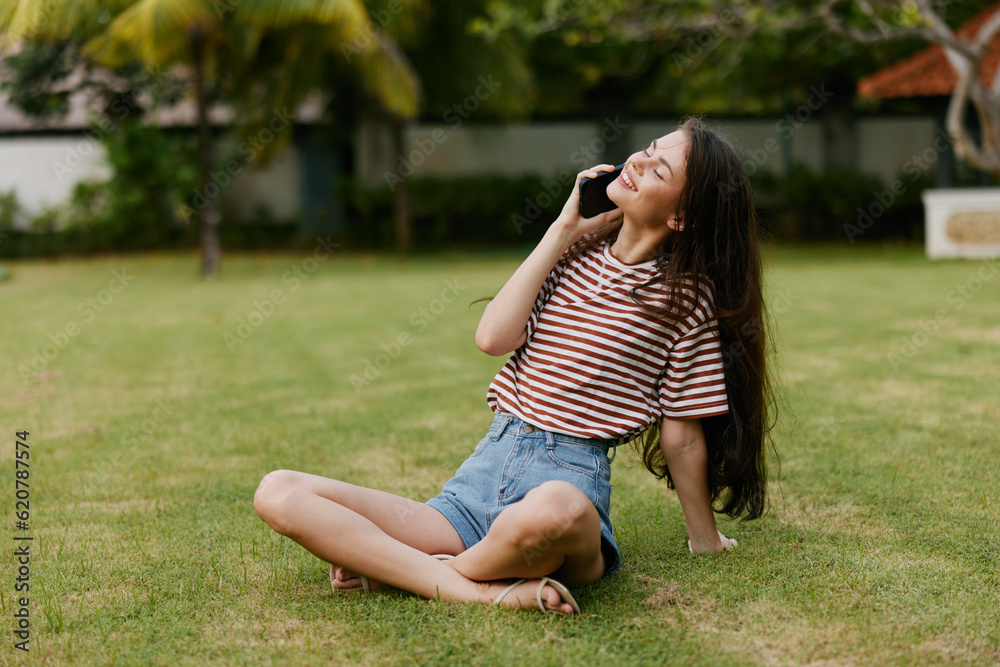 woman smiling grass palm nature lifestyle tree outside blogger phone happy park woman smiling grass palm nature lifestyle tree outside blogger phone happy park